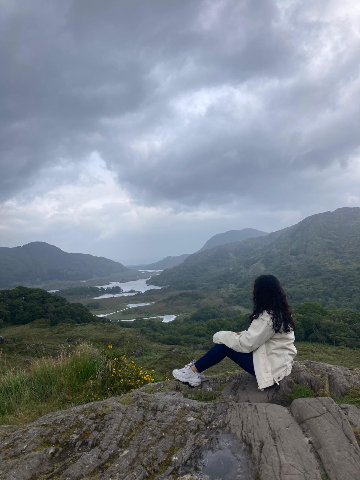 Sitting on a rock above a valley in Kerry